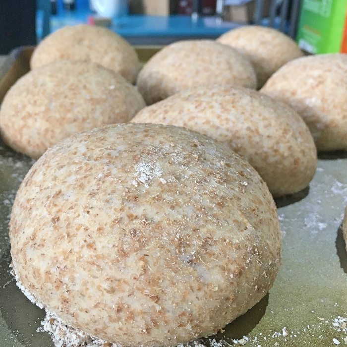 Soft wholemeal rolls after second prove